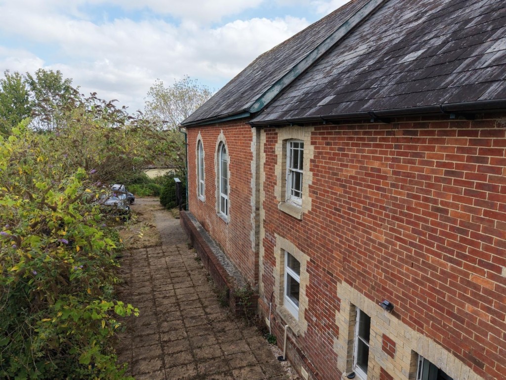 Lot: 170 - FORMER METHODIST CHAPEL WITH PLANNING FOR CONVERSION TO A RESIDENTIAL DWELLING ON PLOT OF 0.39 ACRES - Aerial view of rear elevation